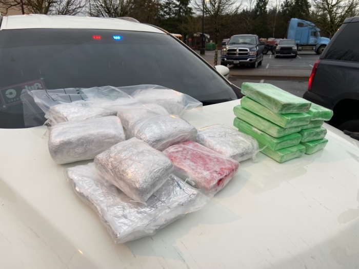 Bags of drugs piled on a vehicle hood