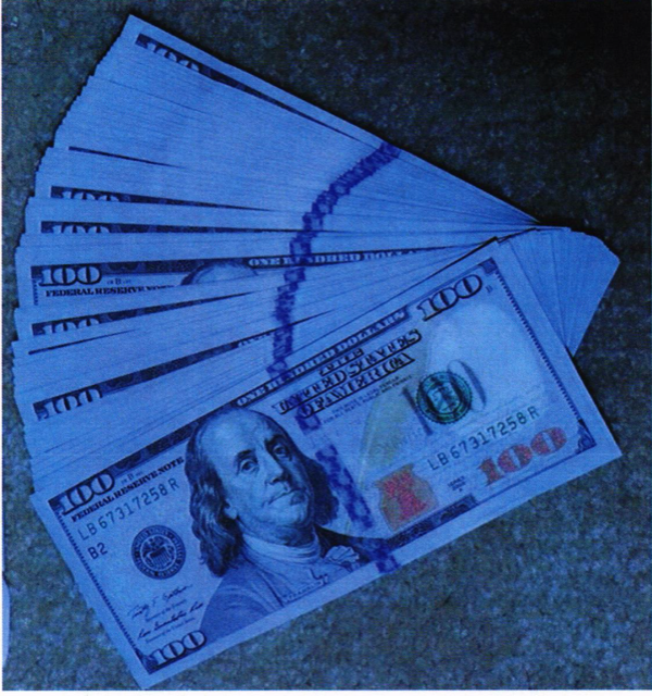 Approximately $14,730 in U.S. Currency $100 bills