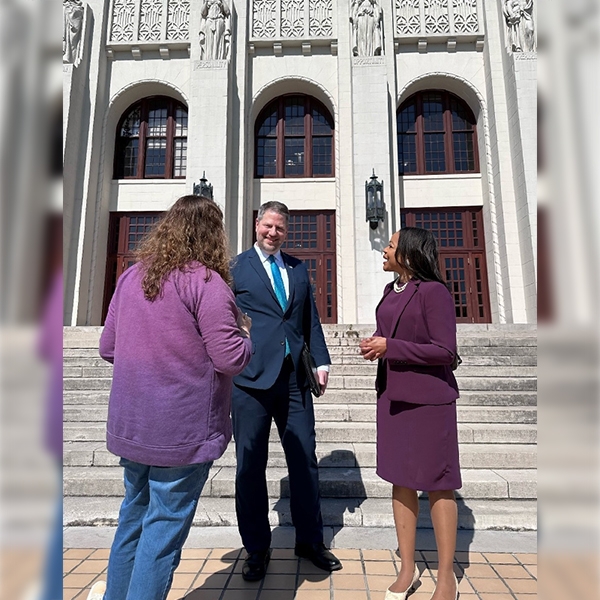 Assistant Attorney General Clarke with U.S. Attorney Ross speaking to a teacher at Little Rock Central High School. Assistant Attorney General Clarke with U.S. Attorney Ross speaking to a teacher at Little Rock Central High School.
