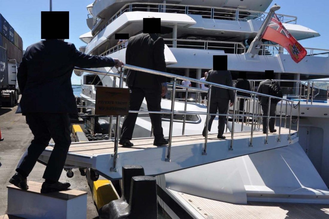 law enforcement boarding a yacht