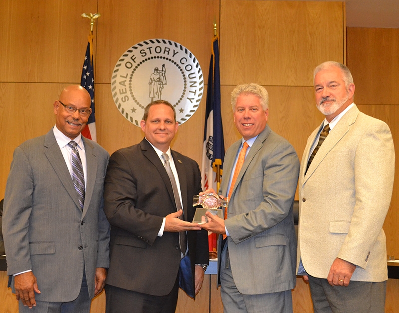 INTERPOL Washington presents the Story County Board of Supervisors with a token of appreciation for their continued support.  Left to right are: Wayne Clinton, Wayne Salzgaber, Rick Sanders, and Martin Chitty. 