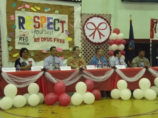 Dignitaries awaiting the start of the Red Ribbon events at Simon Sanchez High School in Guam Picture of Dignitaries awaiting the start of the Red Ribbon events at Simon Sanchez High School in Guam
