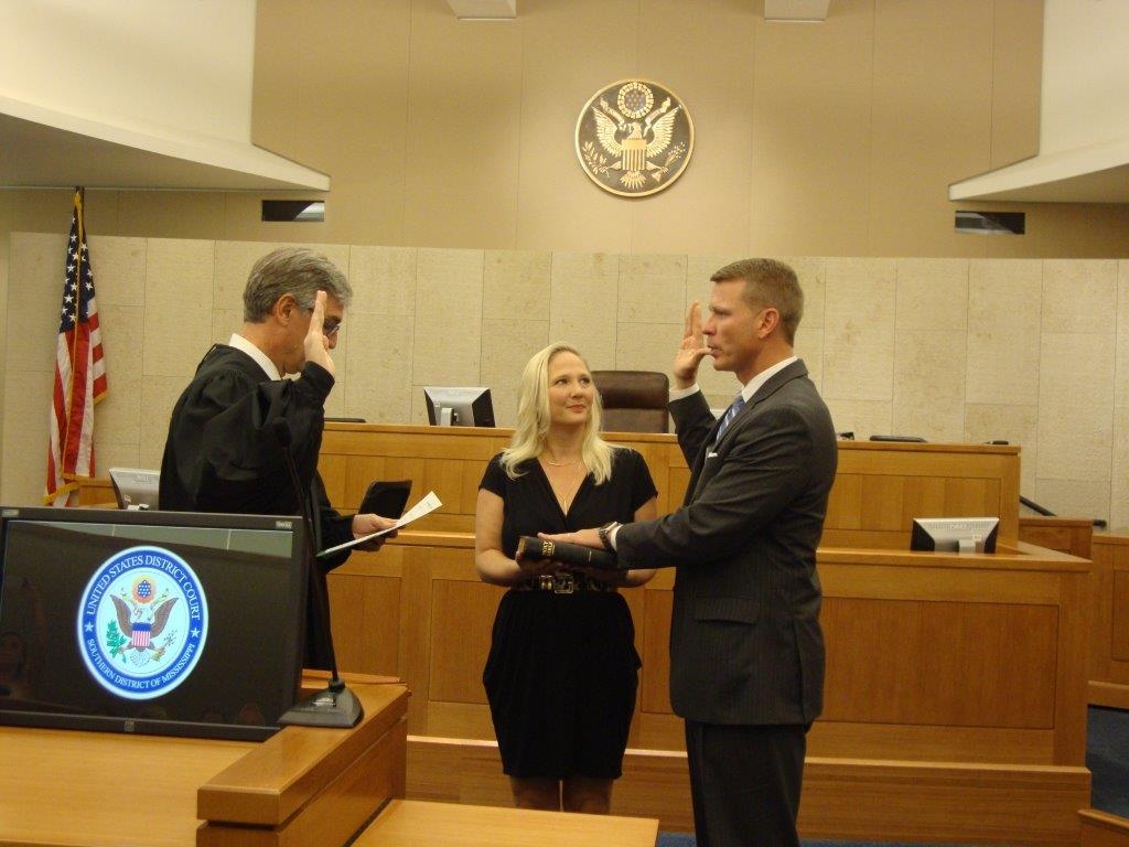 D. Michael Hurst, Jr. was sworn in as the United States Attorney for the Southern District of Mississippi by U.S. District Judge Daniel P. Jordan in Jackson, Mississippi Mike Hurst is sworn in as the United States Attorney for the Southern District of Mississippi by U.S. District Judge Daniel P. Jordan in Jackson, Mississippi. Also pictured is his wife, Celeste.