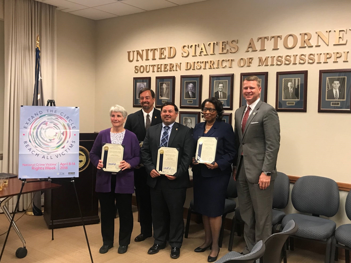Law Enforcement Professionals Demonstrate Exceptional Service to Crime Victims Picture shows U.S. Attorney Mike Hurst with award recipients Glenda Haynes, Todd Key, Lisa Dunn, Richard Johnson and Marge Whitmarsh