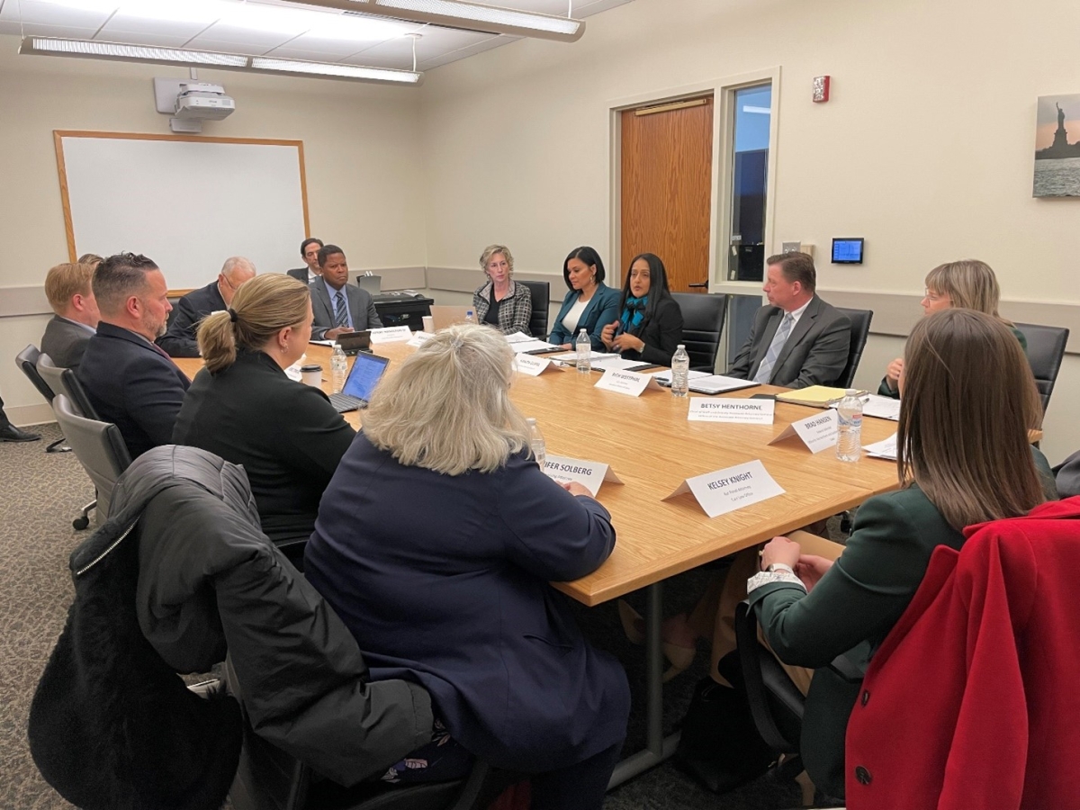 Associate Attorney General Vanita Gupta (mid, center), Access to Justice Director Rachel Rossi (left, center), U.S. Attorney Rich Westphal (right, center) and others participate in a listening session with members of the public defense community.