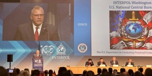 A photo of USNCB Director Michael A. Hughes addressing the INTERPOL 17th Annual Heads of NCB Conference.