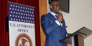 U.S. Attorney for the Southern District of Florida Markenzy Lapointe speaks to a group of community members and Miami Edison Senior High School students during a recent community engagement event. Lapointe, an Edison graduate himself, stressed the importance of education and making good decisions.