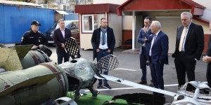 Assistant Attorney General Olsen and Assistant Secretary Axelrod view weapons recovered from the front lines in Ukraine, including ballistic missiles, air-guided missiles, and unmanned aerial vehicles, during their visit to Kyiv in November 2023.