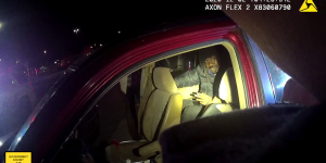 Man in backseat of SUV.
