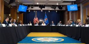 Attorney General Pamela Bondi delivers remarks from the center of a roundtable meeting at the Department of Justice. She is joined by Department of Justice and federal government officials.