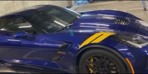Blue Corvette in parking space
