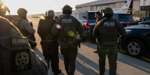 U.S. Marshals & India’s National Investigation Agency at an airport in Los Angeles to transfer custody of Tahawwur Rana, a Pakistani national and Canadian citizen, to representatives from India’s National Investigation Agency. 