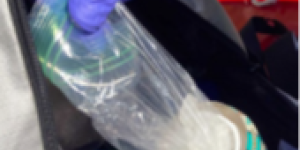 Photo of methamphetamine powder in resealable bag concealed in drink can.