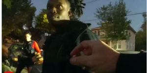 An an image captured on a body-worn camera, an MPD officer reaches to take a marijuana cigarette from the hand of Jayvon Gattison on Oct. 9, 2024. Gattison subsequently was found to be in possession of a loaded Glock 17 9mm pistol, additional cannabis, and crack cocaine