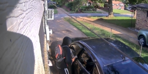 Surveillance Image from the Victim's Home of Simpson Entering the Vehicle After Shooting the Victim