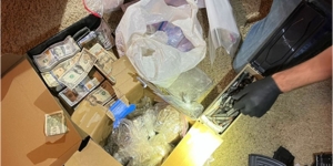 Boxes containing cash and illicit drugs