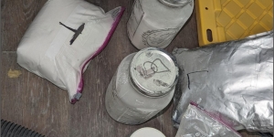 jars and plastic baggie containing powdered narcotics