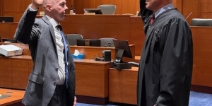 Scott Bradford swearing in with Judge Mosman
