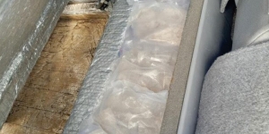 Drugs in a hidden compartment in a vehicle