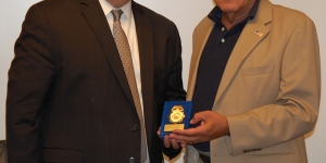 Current USNCB Director Wayne H. Salzgaber presents the first USNCB Chief, Kenneth S. Giannoules, with a token of appreciation.
