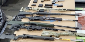 Firearms seized in USA v. Jaberi Rifles and pistols arranged on a table