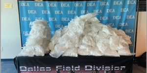 Government exhibit no. 27: Seized methamphetamine piled on a table at DEA's Dallas Field Division