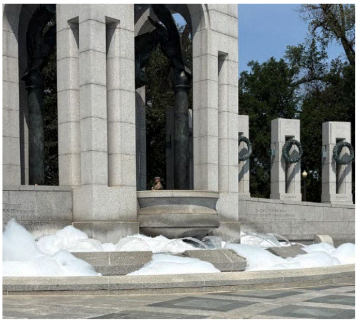 Foam spills from the WWII Memorial on Aug. 13, 2026.