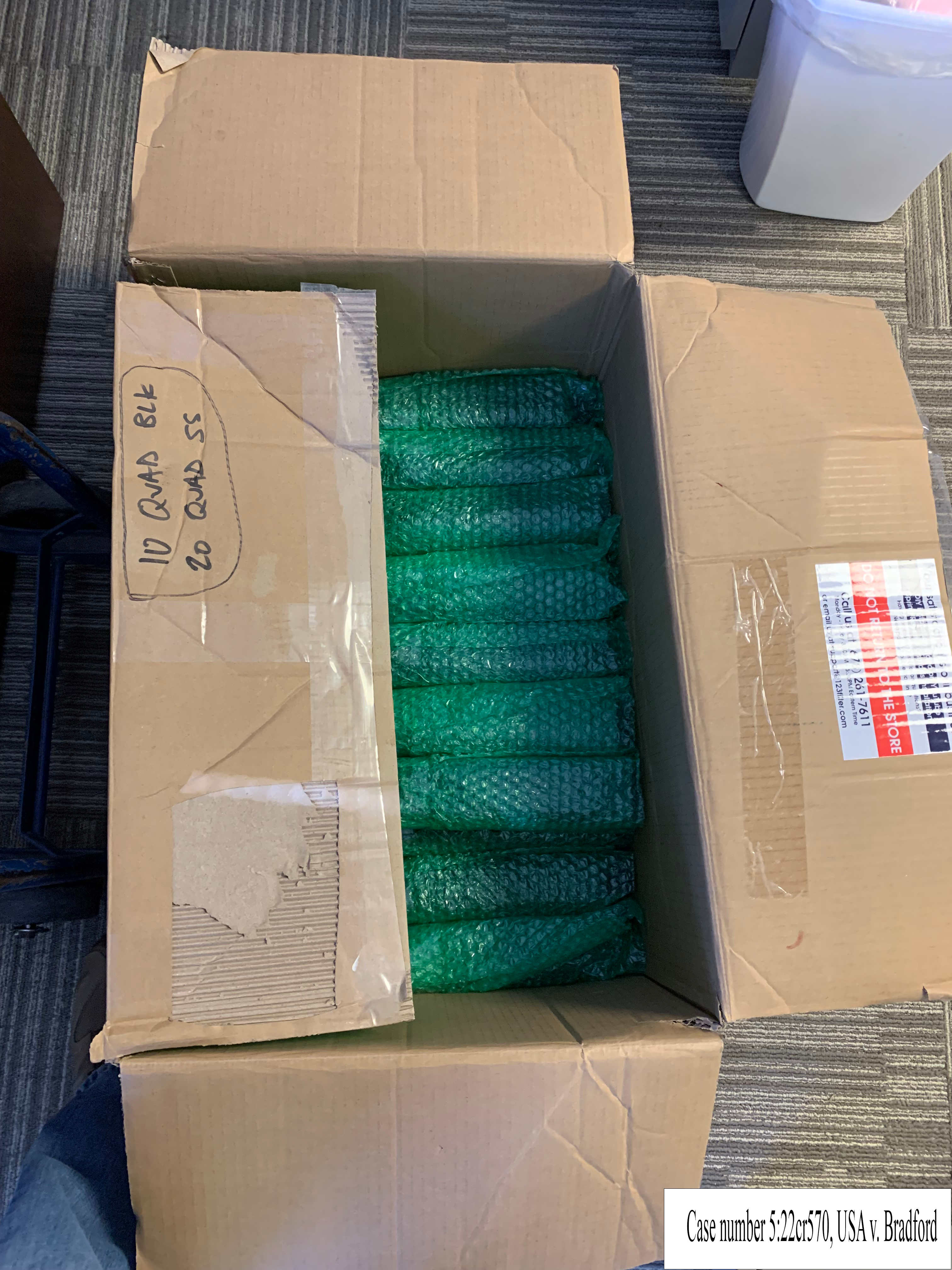 box of firearm components with shipping label removed
