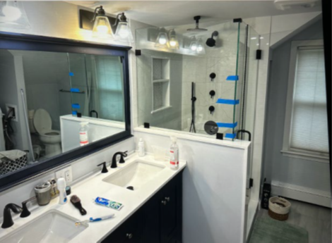 Picture of defendants master bathroom included the installed vanity lights, bathroom vanity and faucet fixtures – all of which were purchased using WHA’s charge account at Home Depot