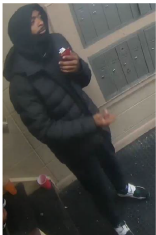 Welch at the Benning Courts apartment building in a surveillance photo captured the day of the shooting.