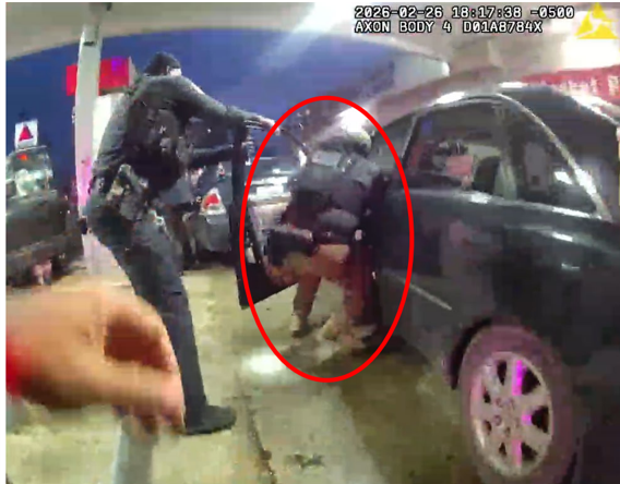 In this body-worn camera photo, officers struggle to take Marson into custody at the gas station.