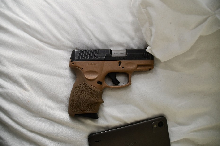 firearm on bed