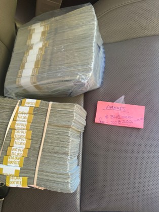 Image of cash from a photograph taken by one of the defendants