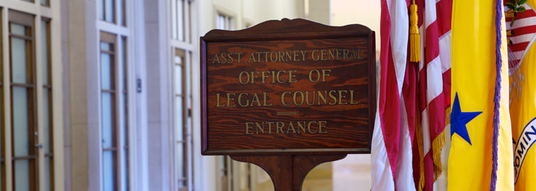 Office of Legal Counsel wooden door sign