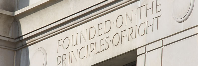 Photograph of the inscription reading Founded on the Principles of Right from the DOJ building. Photograph of the inscription reading Founded on the Principles of Right from the DOJ building.