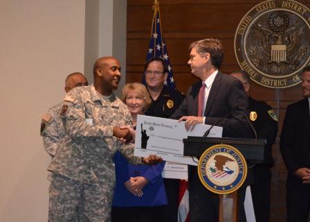 USA presents funds to Florida National Guard Counterdrug Program representatives.