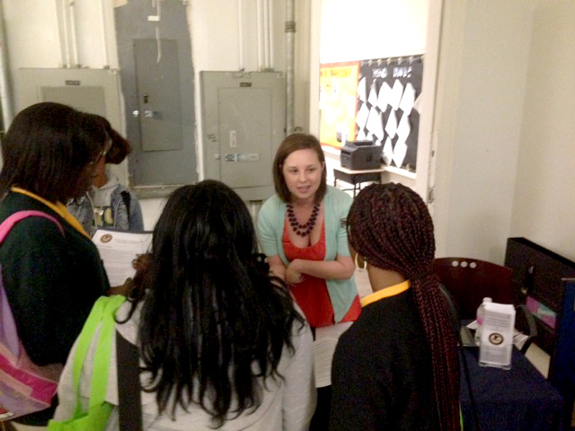 EDLA employee meeting with students.