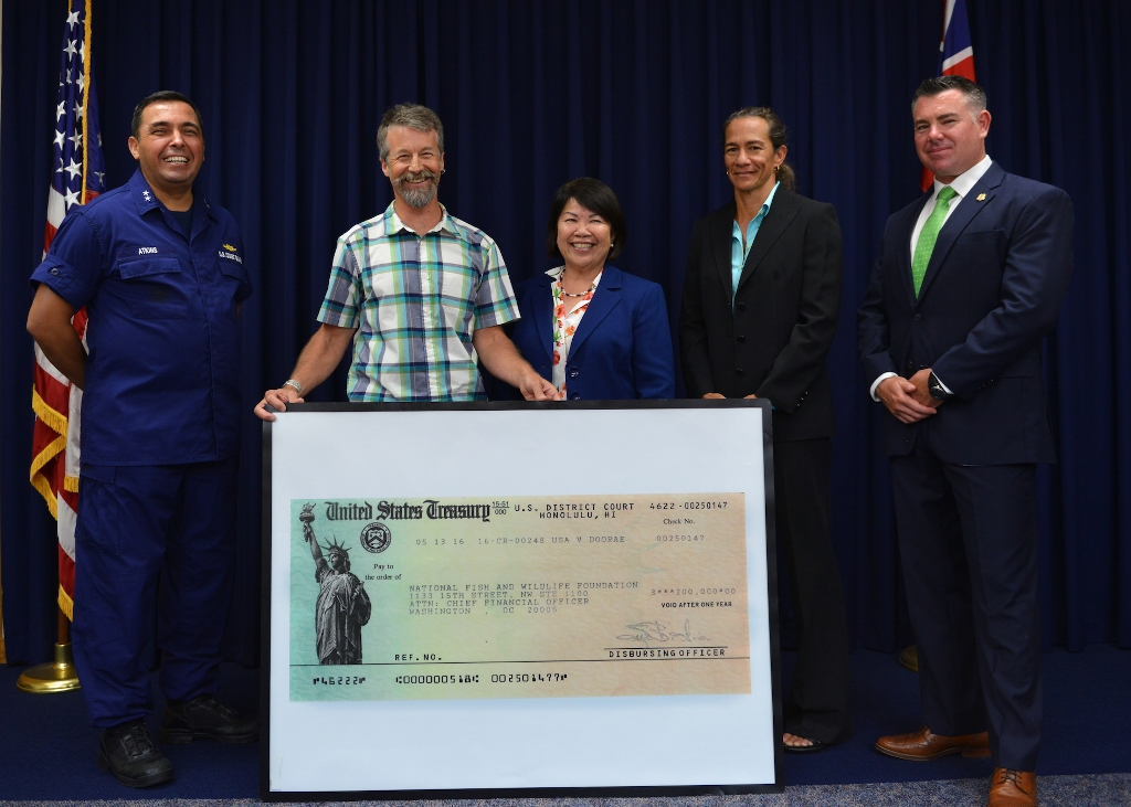 Rear Adm. Vincent Atkins, Commander, 14th Coast Guard District; Scott Hall, Director of Seabird Conservation with the National Fish &amp; Wildlife Foundation, US Attorney Florence Nakakuni; Resident Agent-in-Charge Donna Kahakui of the Environmental Protection Agency, &amp; Special Agent Eric Goldberg of the Coast Guard Investigative Service