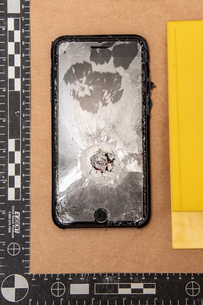 Evidence photo of a shattered iPhone.