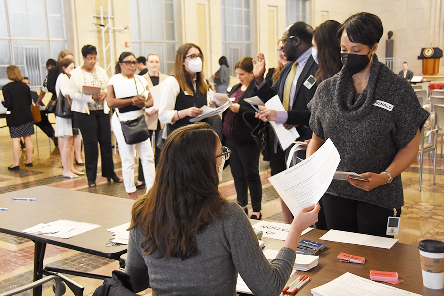 A long line of participants is formed to obtain a simulated identification card.