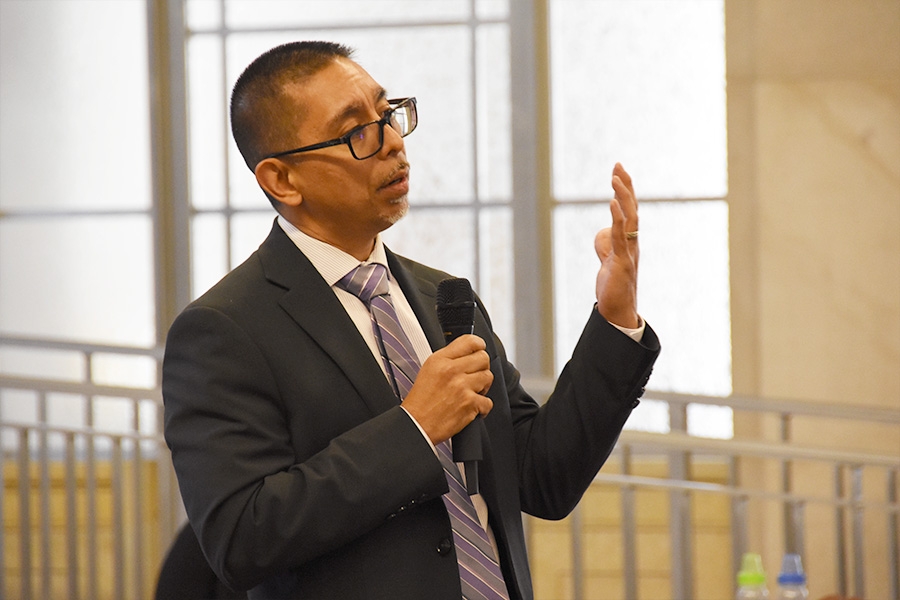 A Reentry Coordination Council member shares his knowledge of obstacles to re-entry with the participants.