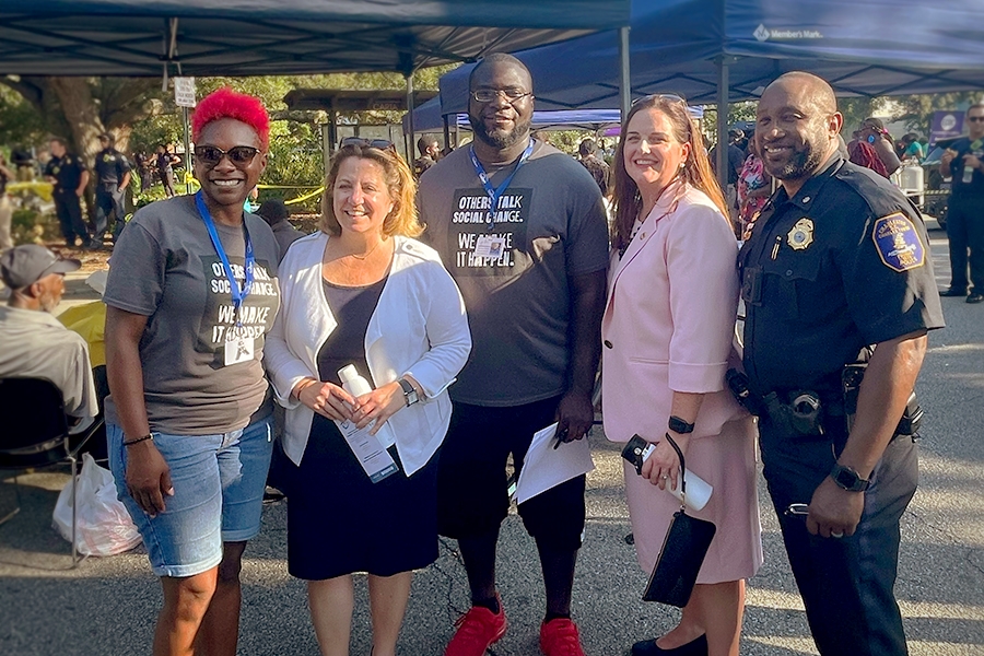 Deputy Attorney General Lisa O. Monaco stands with law enforcement officers on National Night Out in Charleston, S.C.