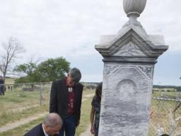Attorney General Holder lays a wreath at the Wounded Knee Memorial Site