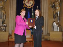 Acting Assistant Attorney General Sharis Pozen presents a 2011 Assistant Attorney General Award to Christine Hill.