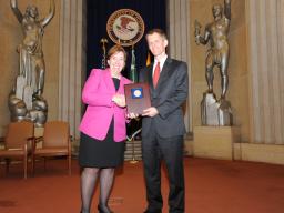 Acting Assistant Attorney General Sharis Pozen presents the 2011 Morrison Award to Jon Jacobs.