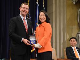 Acting Associate Attorney General Stuart F. Delery thanks Chair Yang after she delivers the keynote address.