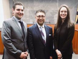 AAG Makan Delrahim (center) joined by George Washington University Law School Students