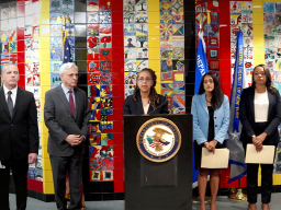 U.S. Attorney Trini E. Ross delivers remarks at a podium in Buffalo, New York.