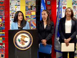 Associate Attorney General Vanita Gupta delivers remarks at a podium in Buffalo, New York. 