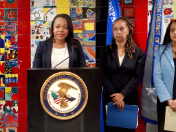 Assistant Attorney General Kristen Clarke delivers remarks at a podium in Buffalo, New York.